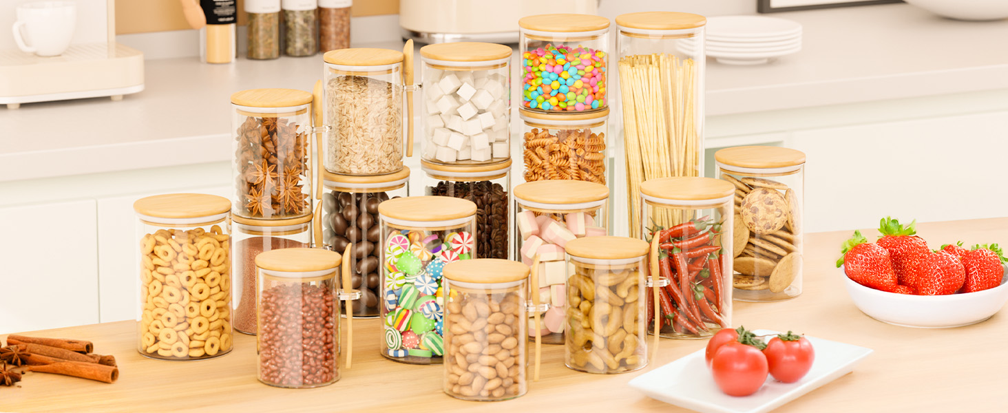 Clear food storage jars arranged on a bright kitchen counter